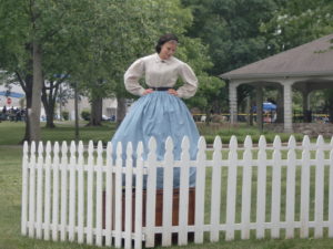 A Lucy Hood reenactor posing with a fence at the Carthage 2011 Civil War reenactment event